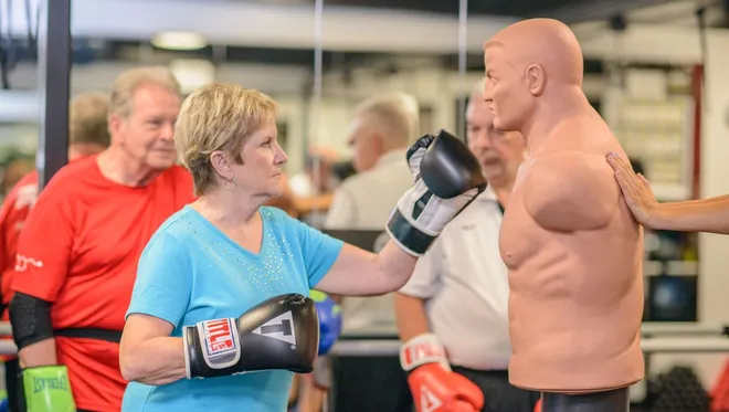 Group of people participating in non-contact boxing, highlighting a beneficial exercise for Parkinson’s.